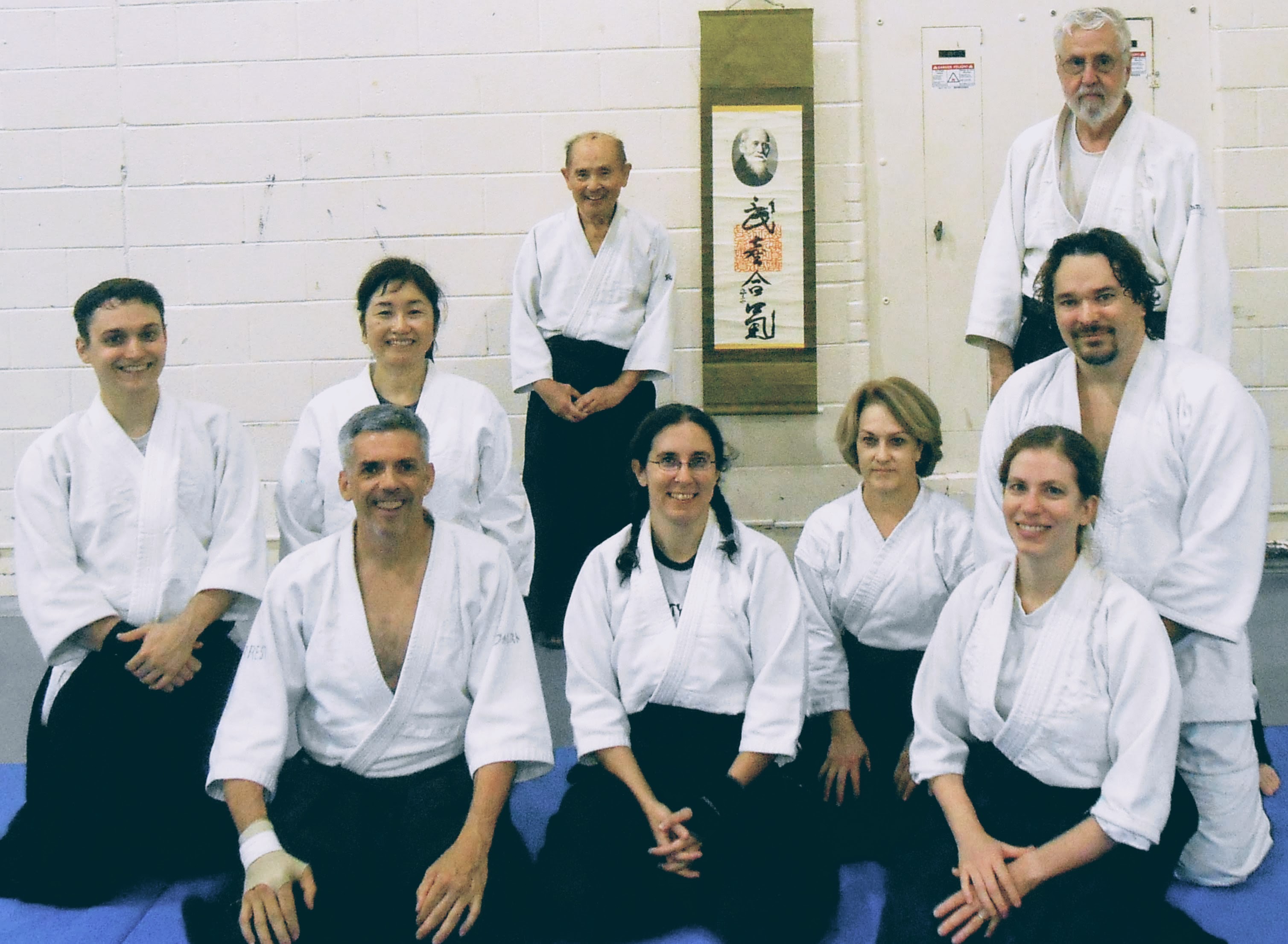 Sensei with students in front of O Sensei